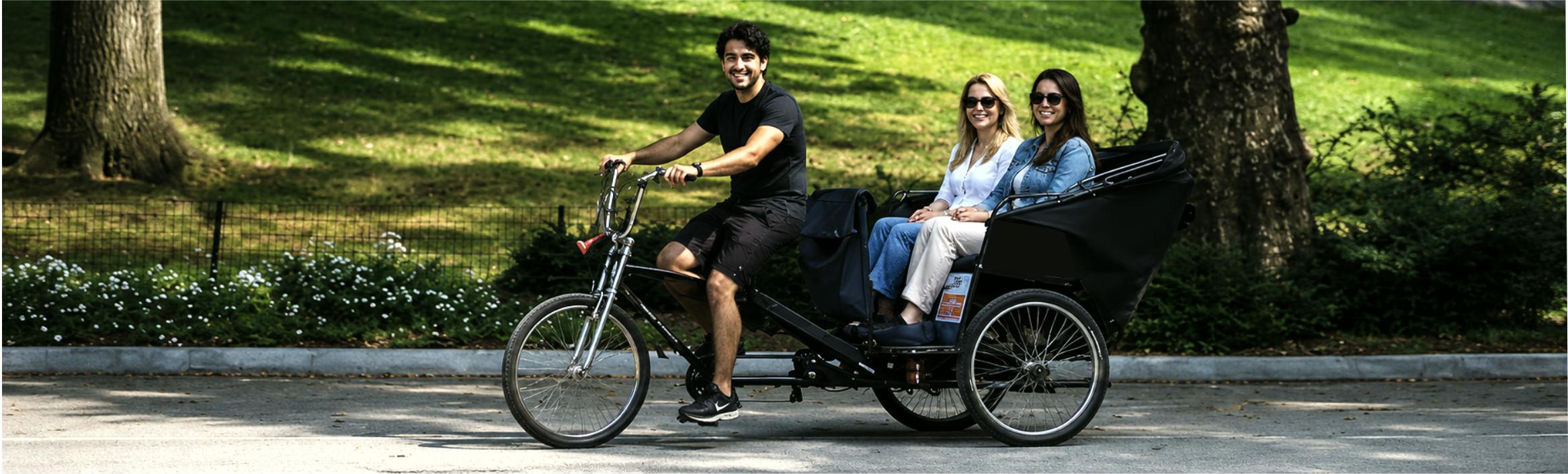 Central Park proposal pedicab tour arriving at Bow Bridge for a romantic engagement